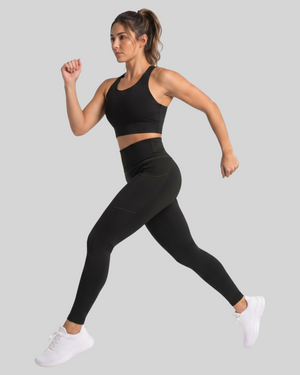 Black high-waisted pocket leggings by Proven Sportswear, showing the fitted design and functional side pockets.