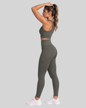 Olive brown high-waisted pocket leggings by Proven Sportswear, shown flat with pockets and stretchy fabric for active wear.