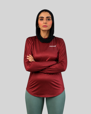 Maroon long sleeve performance sports T-shirt by Proven Sportswear, featuring breathable fabric and athletic fit.