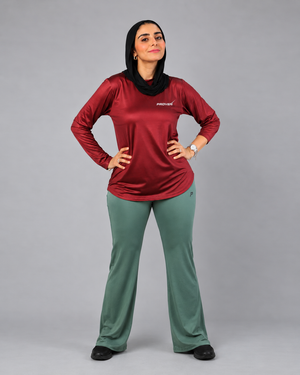 Maroon long sleeve performance sports T-shirt by Proven Sportswear, shown on a mannequin highlighting its fitted design and breathable fabric.