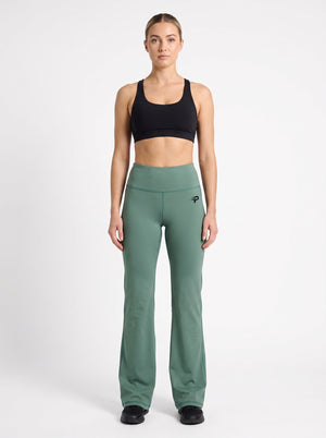 Olive green flare leggings by Proven Sportswear showing a close-up of the fabric and flare design on the legs.