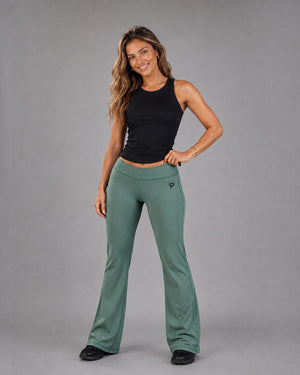Olive green Flow Flare Leggings by Proven Sportswear, showing the high-waisted design and flare leg style on a model.