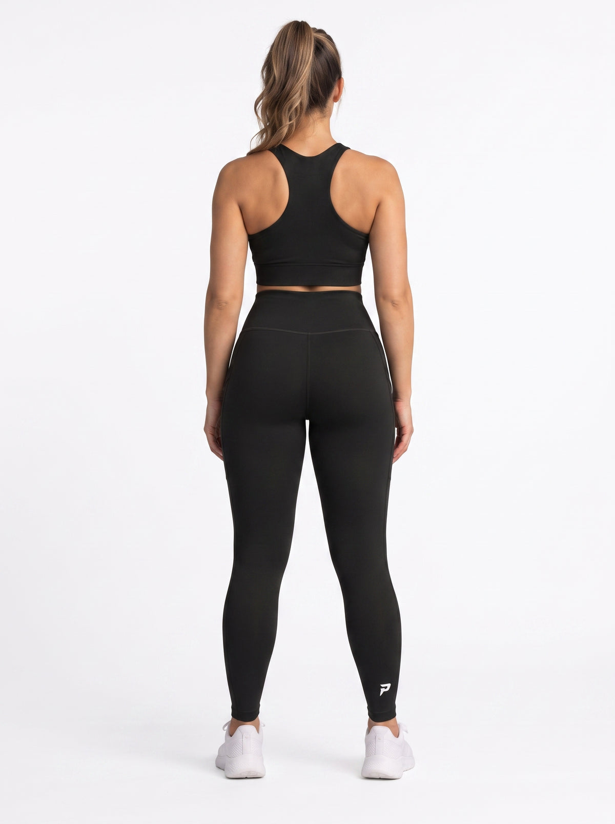 Black high-waisted pocket leggings by Proven Sportswear, featuring a sleek fit and functional side pockets for active wear.