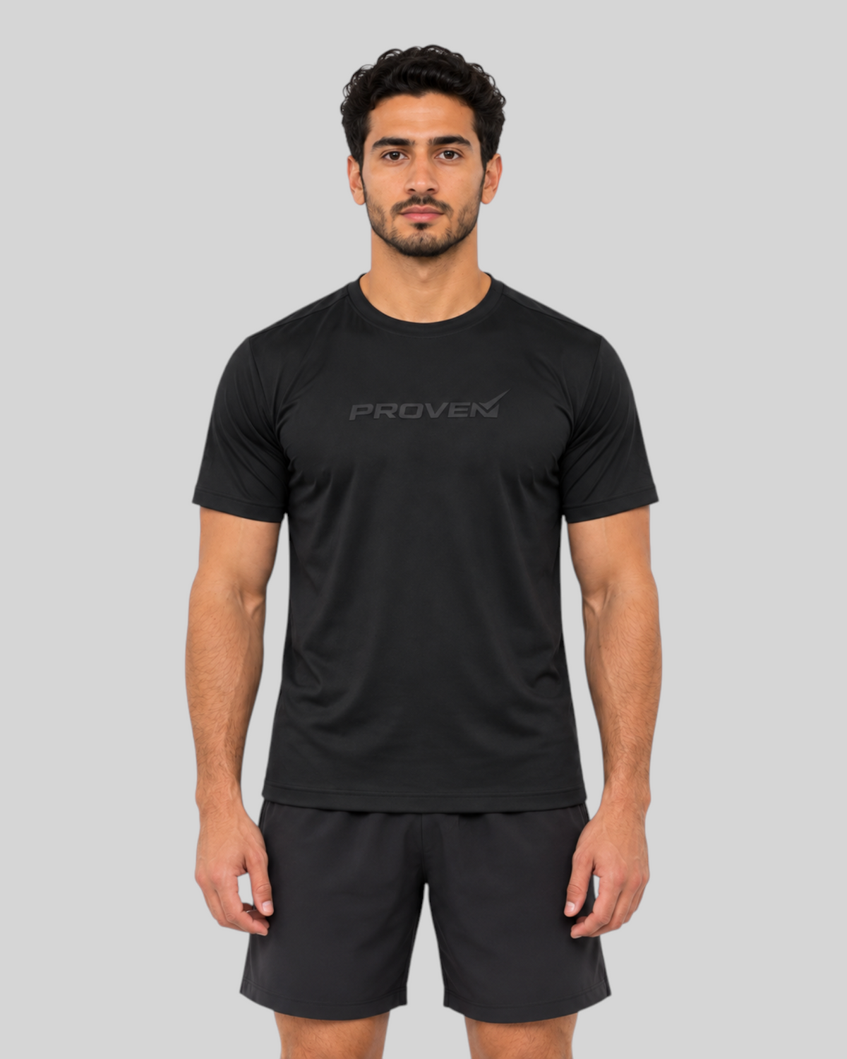 Black Proven Sportswear Performance Tee sports T-shirt, close-up of fabric and fit on a mannequin.