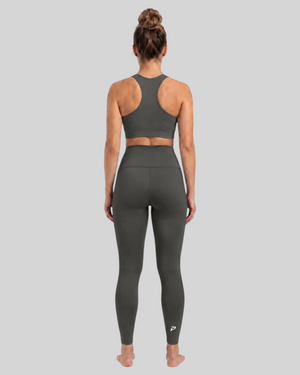 High-waisted olive brown pocket leggings by Proven Sportswear, showing the stretchy fabric and functional pockets.