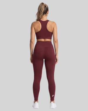 Maroon high-waisted pocket leggings by Proven Sportswear, featuring a comfortable fit and functional side pockets.