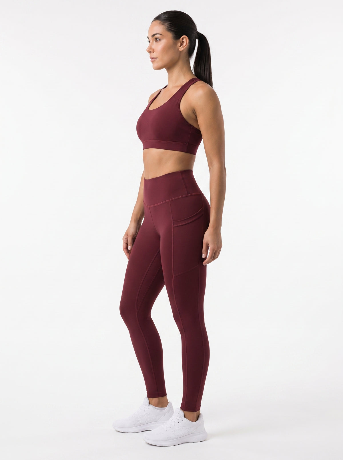 Maroon high-waisted pocket leggings by Proven Sportswear, showing a close-up of the textured fabric and pocket details.