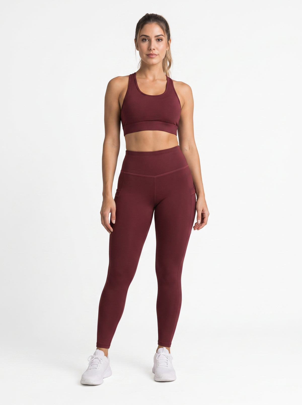 Maroon high-waisted pocket leggings by Proven Sportswear, showing a close-up of the comfortable, stretchy fabric and functional pockets.