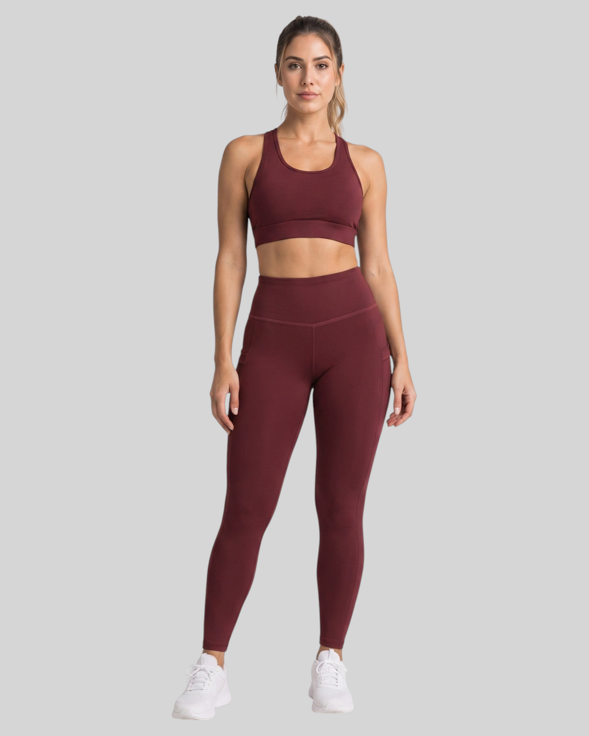 Maroon high-waisted pocket leggings by Proven Sportswear, showing a close-up of the comfortable, stretchy fabric and functional pockets.