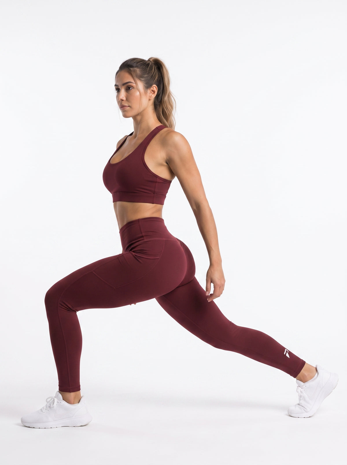 Maroon high-waisted pocket leggings by Proven Sportswear, showing the full length of the fitted athletic leggings with side pockets.