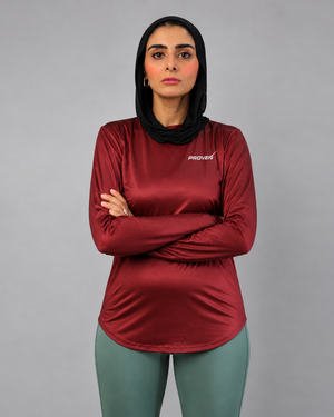 Maroon long sleeve performance sports T-shirt by Proven Sportswear, featuring breathable fabric and athletic fit.