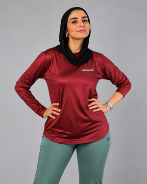 Maroon long sleeve performance sports T-shirt by Proven Sportswear, featuring breathable fabric and athletic fit.