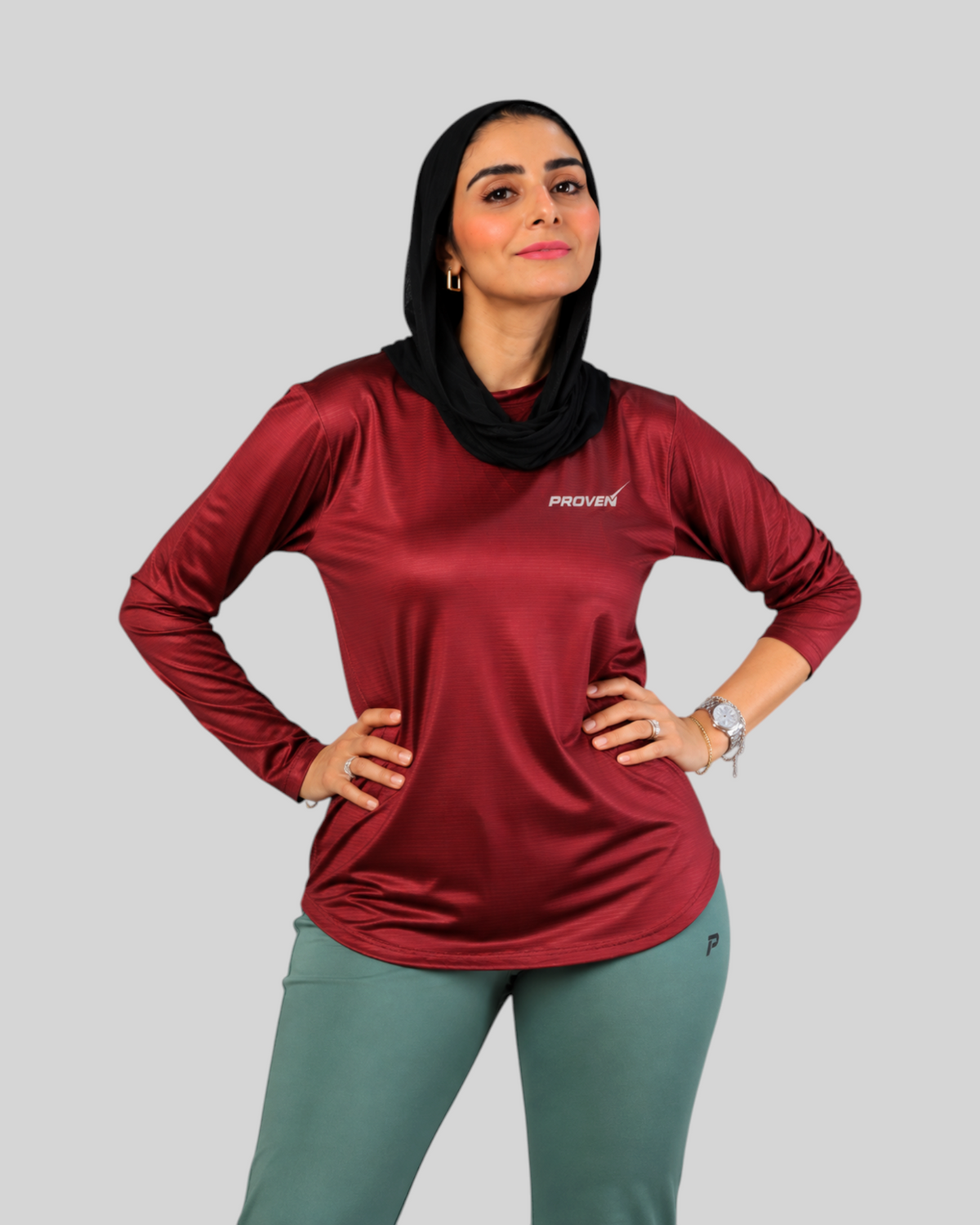 Maroon long sleeve performance sports T-shirt by Proven Sportswear, featuring breathable fabric and athletic fit.