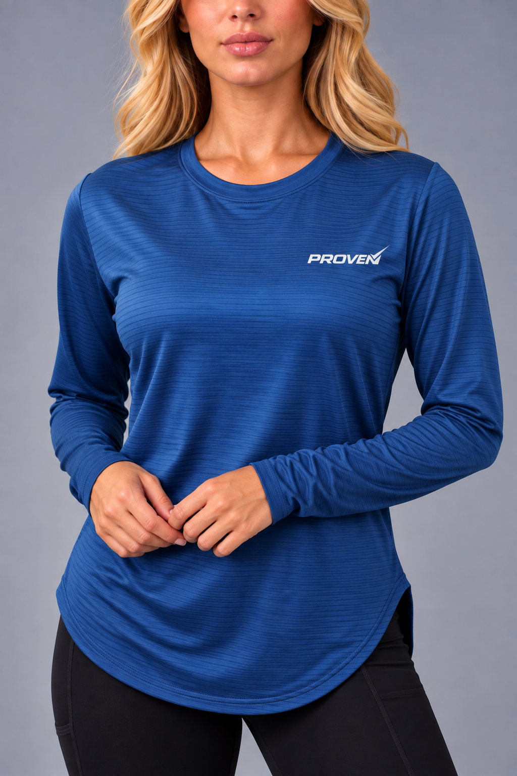 Blue long sleeve performance sports T-shirt by Proven Sportswear, shown on a model, designed for athletic comfort and flexibility.