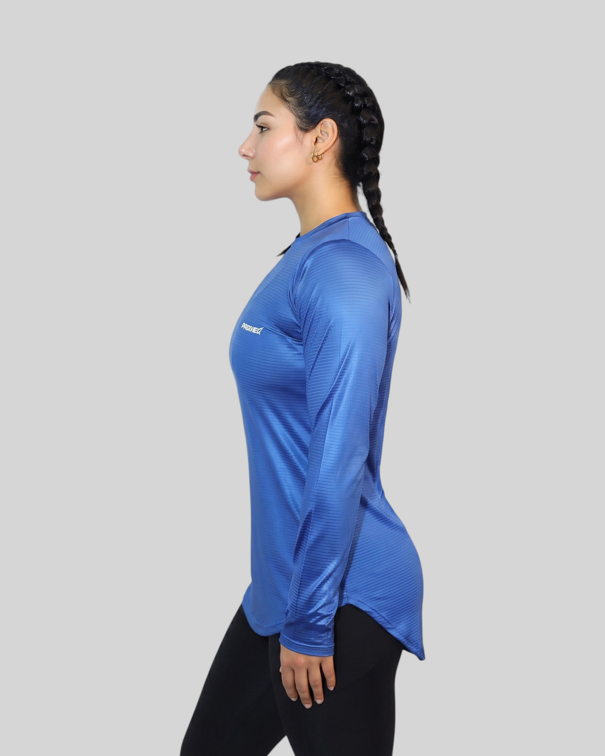 Blue long sleeve performance sports T-shirt by Proven Sportswear, shown on a model with breathable fabric and athletic fit.