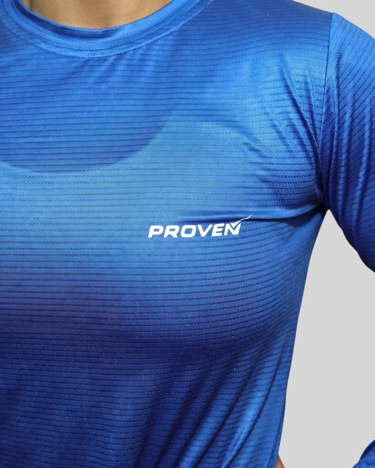 Blue long sleeve performance sports T-shirt by Proven Sportswear, shown with lightweight, breathable fabric design.