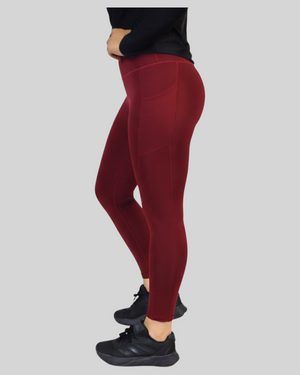 Maroon high-waisted pocket leggings by Proven Sportswear, featuring a snug fit and functional side pockets for active wear.