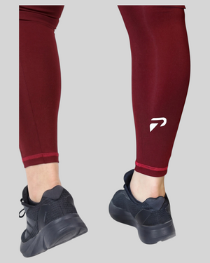Maroon high-waisted pocket leggings by Proven Sportswear, featuring a comfortable fit and functional side pockets.
