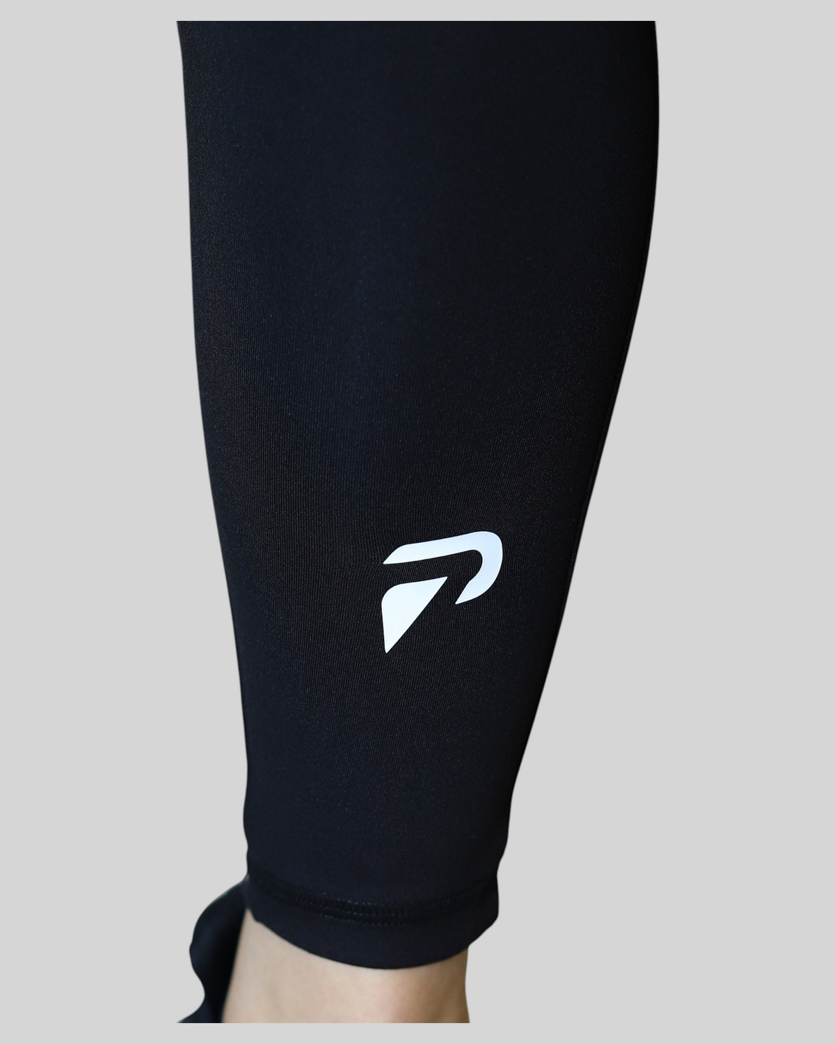 Black high-waisted pocket leggings by Proven Sportswear, showing the fit and side pocket detail on a model.