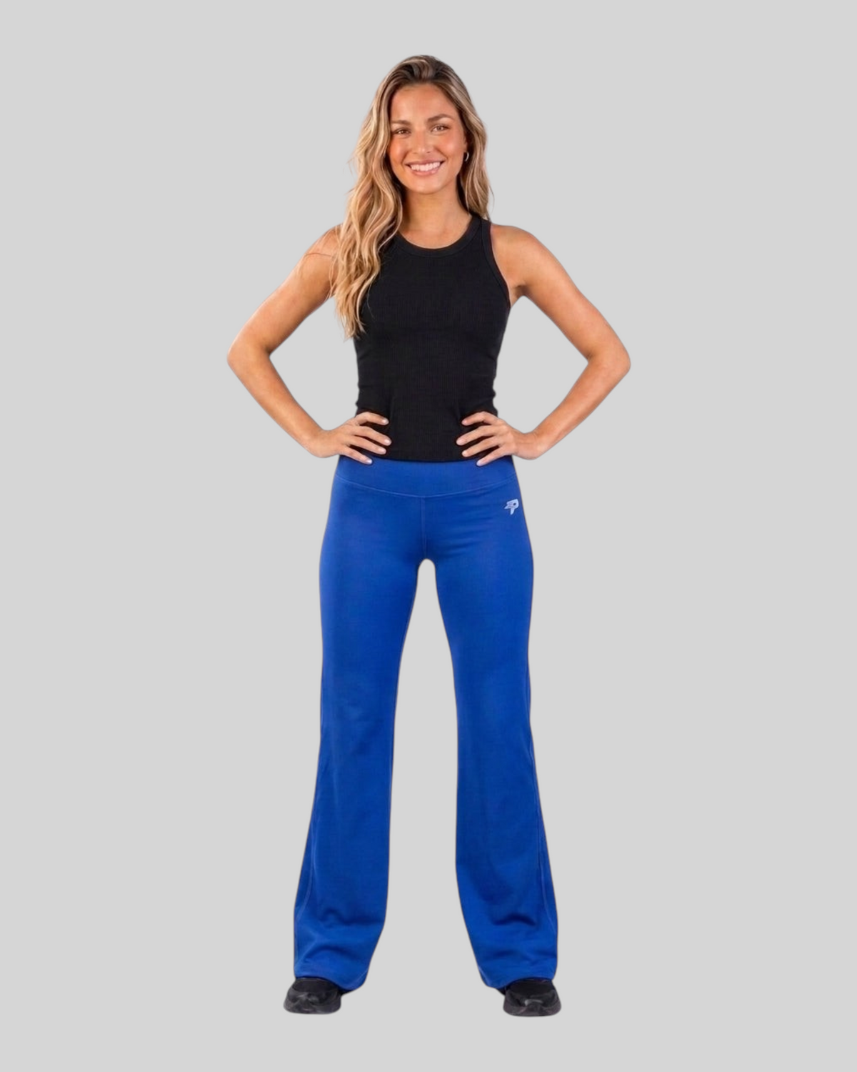 Navy blue flare leggings by Proven Sportswear featuring a stylish flow flare design on a model, perfect for activewear.