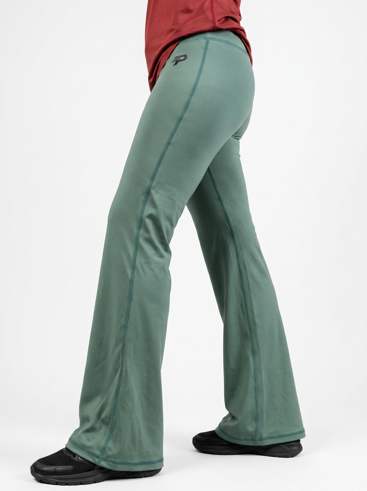 Olive Proven Sportswear flow flare leggings displayed on a model, showcasing the stylish, high-waisted design and flared leg detail.