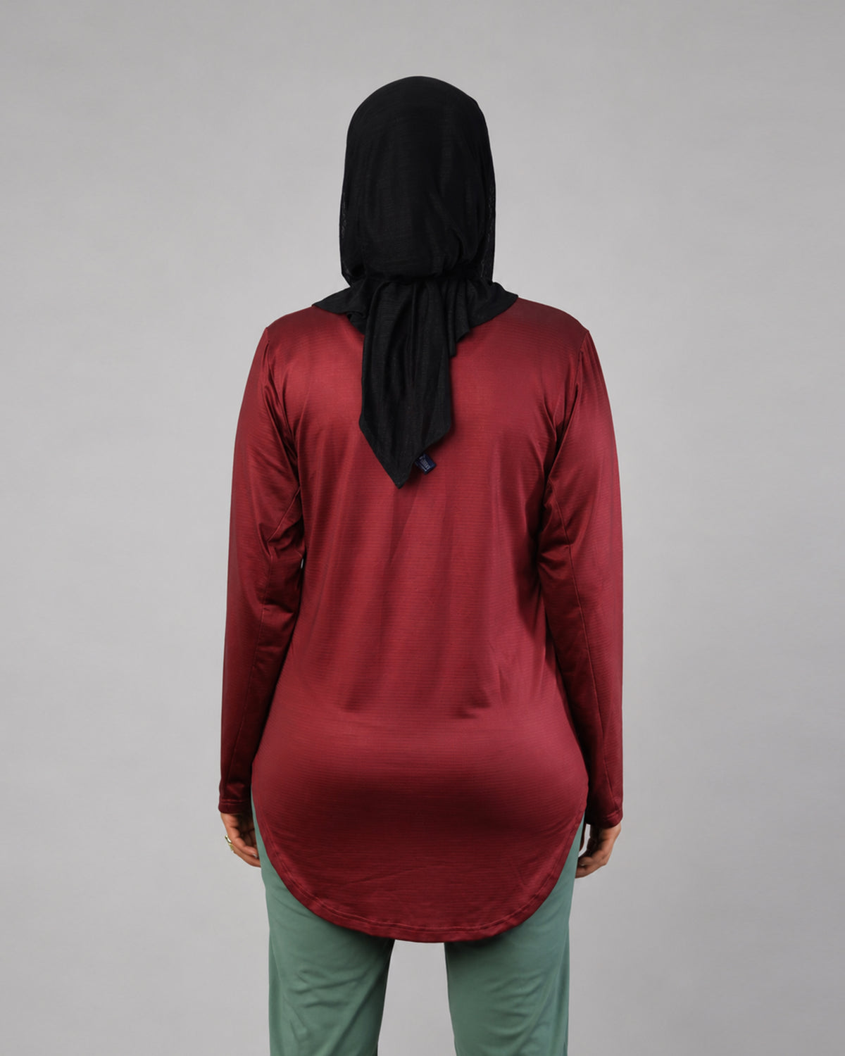 Maroon long sleeve performance sports T-shirt by Proven Sportswear, made of breathable fabric for active wear.