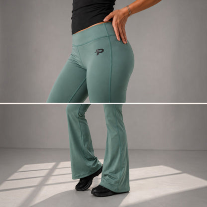 Olive Proven Sportswear flow flare leggings with a high waistband and relaxed fit, shown on a model standing in a studio setting.